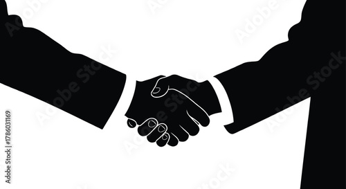 Two business people in silhouette shaking hands in agreement on a white background symbolizing partnership and success