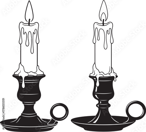 Two lit candles in antique candle holders silhouette