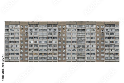 Nine storey apartment building facade with balconies is isolated.