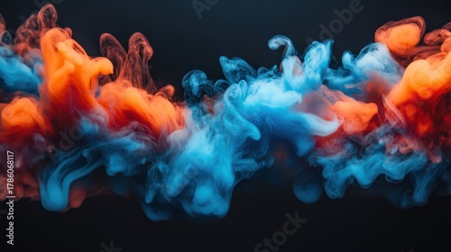 Abstract ink colors mixing on black background.  Possible use stock photo for design, art, or science-related visuals