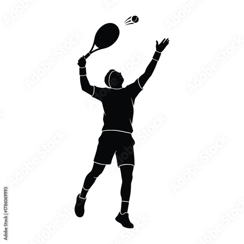 Silhouette of a tennis player serving the ball