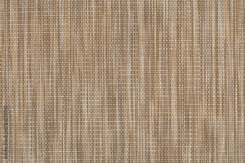 Natural rattan woven texture background. Brown wicker fabric pattern close-up