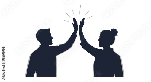 Two silhouetted figures a man and a woman giving each other a high five in celebration of success or teamwork