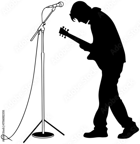 Silhouette of Guitarist Playing Live at Microphone