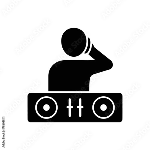 A silhouette of a DJ operating a soundboard in a club.