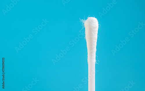 Cotton bud or Cotton swab isolated on blue background, Close-up