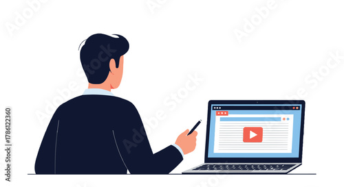 Man in suit using a laptop with a video player on screen representing online learning or content consumption
