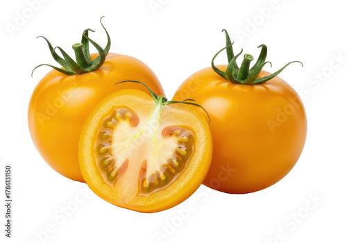 Two vibrant whole yellow tomatoes with green calyxes, one sliced revealing juicy interior, on a transparent studio background, soft light, macro. Concept of fresh healthy produce