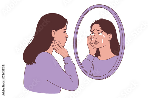 A young woman cries while looking at her reflection in a mirror.
