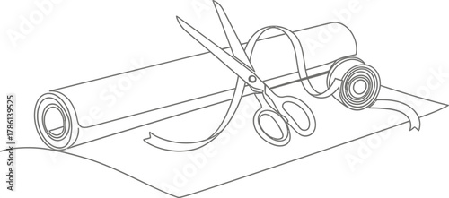 Scissors cutting ribbon on paper roll crafting materials