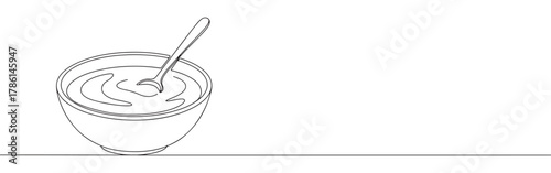 Continuous one line drawing of a bowl with a spoon. Concept of food, eating and healthy lifestyle