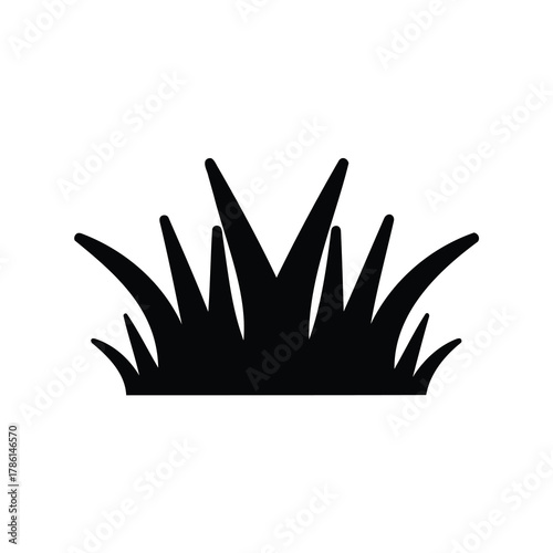 Minimalist depiction of a clump of grass in black and white