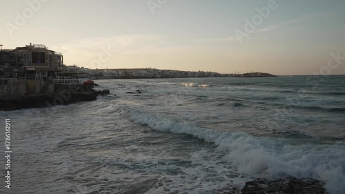 View of beach and hotels in Limenas Chersonisou at dusk, Limenas Chersonisou, Crete, Greek Islands, Greece, Europe