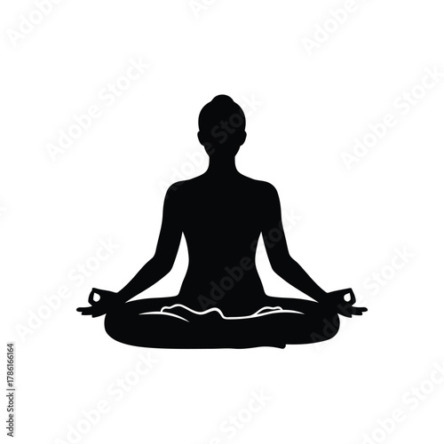 Silhouette of a person meditating in lotus position