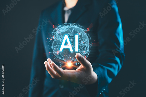 AI Artificial Intelligence technology concept, A businessman holding a glowing holographic globe with AI text, digital transformation, and innovation in technology for business and future development