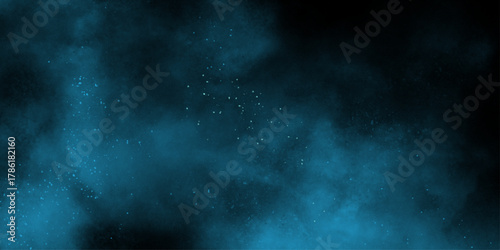 Blue powder dust smoke on black background. abstract background. Space of night sky with cloud and stars. Nebula and galaxies in space. Abstract cosmos background.