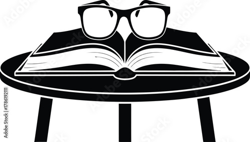 Open Book with Glasses on a Table Silhouette reading spectacles