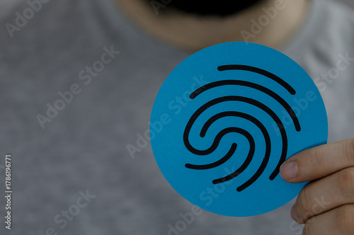 Person holding a blue finge...