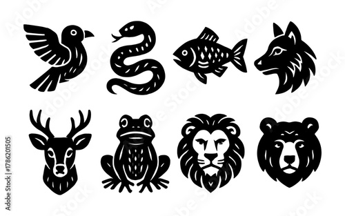 Set of animal silhouettes: birds, reptiles, fish, and mammals in bold black design