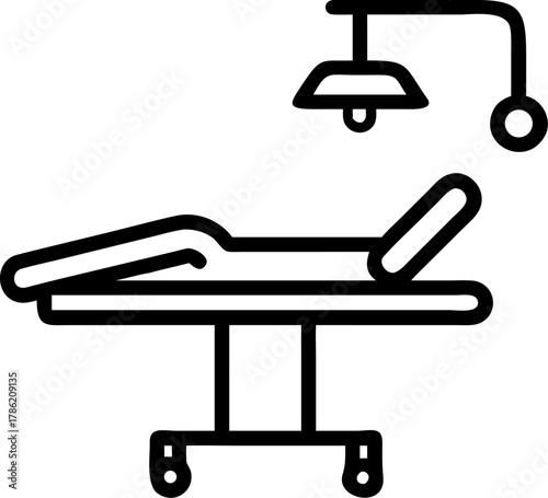 Medical examination table with surgical lamp