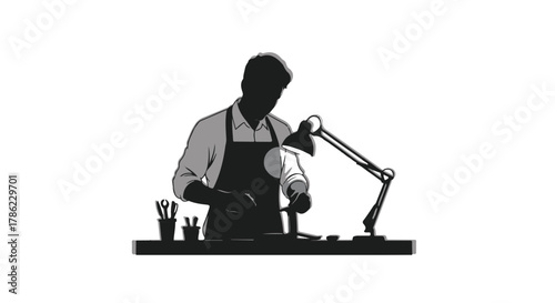 Focused artisan meticulously crafting at a well-lit workbench