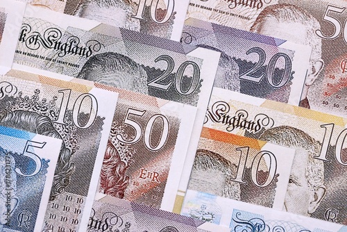 British pounds currency money bills in big amount. Many GBP currency banknotes with different denomination close up