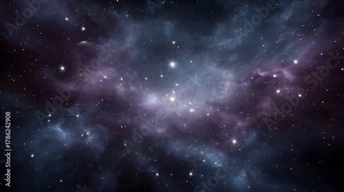 Vibrant purple and blue nebula clouds filled with bright stars in the vast expanse of deep space