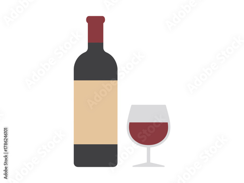 A bottle of red wine stands next to a glass filled with the beverage.