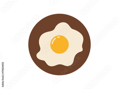 A perfectly cooked fried egg sits on a round, brown plate.