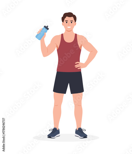 A healthy man in athletic wear holds a water bottle, ready for his workout.