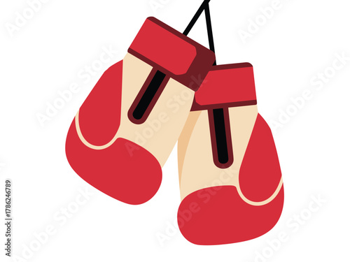 A pair of red and white boxing gloves hang from a string against a white background.