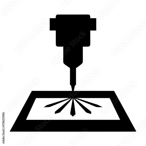 Industrial laser cutting machine engraving a surface silhouette
