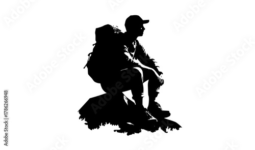 a silhouette of a man sitting on a rock with a large backpackbaseball hat, jump, man, person, profile, ride, skate, skateboard, skateboarder, skater, snowboarder, stunt, trick 