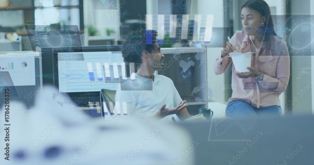 Obraz premium Discussing coworkers at office in white shirt pink blouse using chopsticks, glass-reflected data