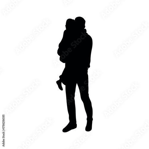 Silhouette of father holding child in arms. Family love and care