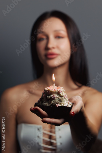 Beauty portrait of a pretty girl with a cake 