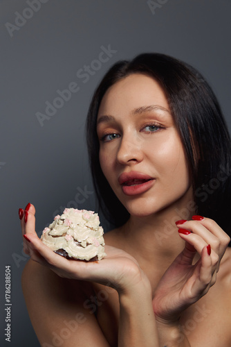 Beauty portrait of a pretty girl with a cake 