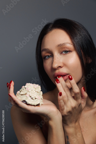 Beauty portrait of a pretty girl with a cake 
