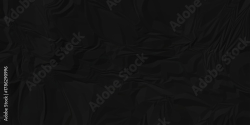 Dark black page wrinkle cardboard crumpled satin fabric ripped cloth decoration background	
