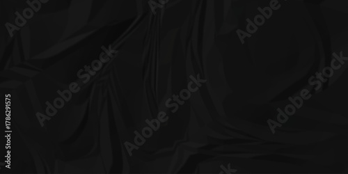 Dark black page wrinkle cardboard crumpled satin fabric ripped cloth decoration background	
