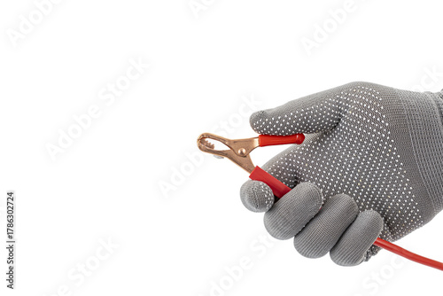 Tableau sur toile Gloved Hand Holding Red Alligator Clip Wire Against White Background: Highlighti