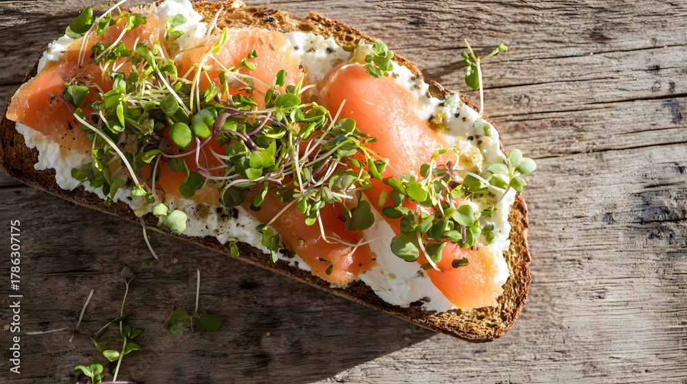 Fototapeta premium Gourmet open sandwich creamy ricotta smoked salmon microgreens rustic food photography lifestyle