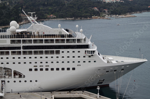 Italian family cruiseship cruise ship liner Lirica, Armonia or Sinfonia in port of Dubrovnik, Croatia during Summer Mediterranean cruising with harbor infrastructure marine traffic