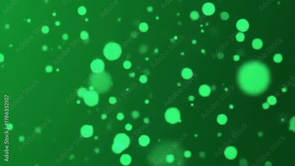 Abstract green bokeh background with shimmering light particles creating a magical and festive atmosphere perfect for overlays transitions and creative design projects.