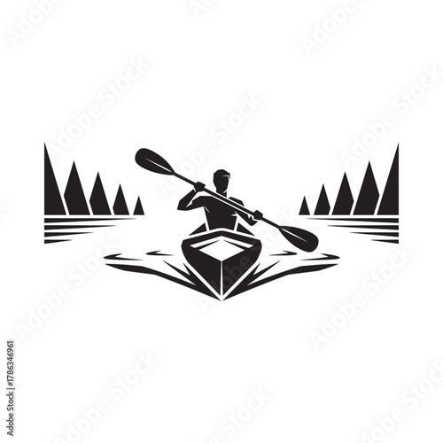 Silhouette of a kayaker paddling through water with trees