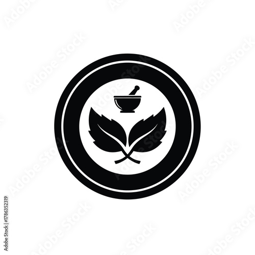 Black mortar and pestle with leaves inside circle herbal