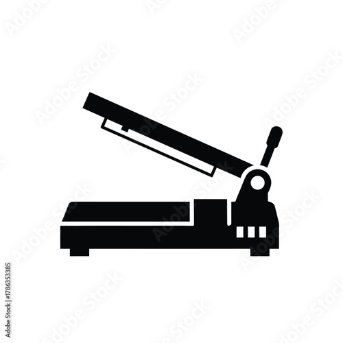 Black paper cutter with open lid and handle machine