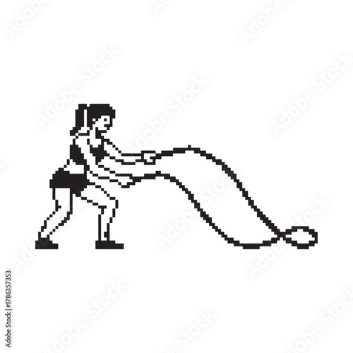 Woman performing battle rope exercise for fitness and strength training