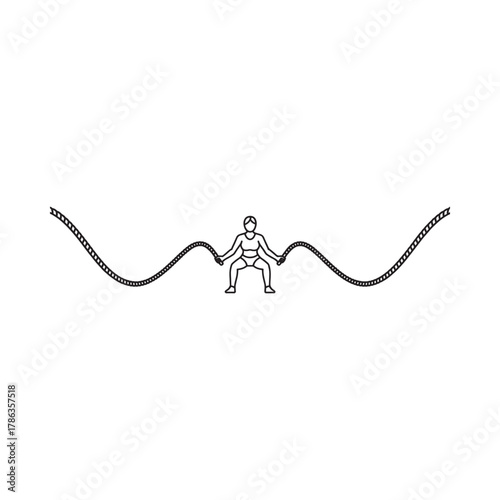 Person performing battle rope exercise with dynamic wavy ropes