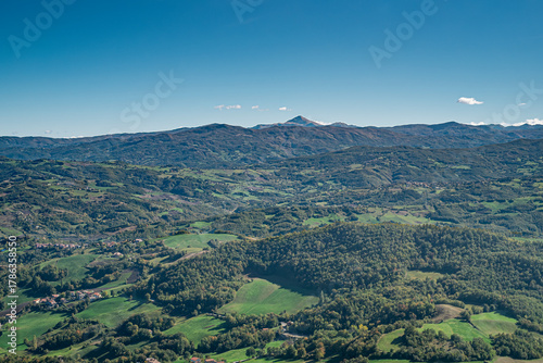 The mountains, forests, pastures and villages where Parmigiano-Reggiano is produced. Provinces of Modena and Reggio Emilia, Italy. Taken from the Pietra di Bismantova; Mount Cimone on background